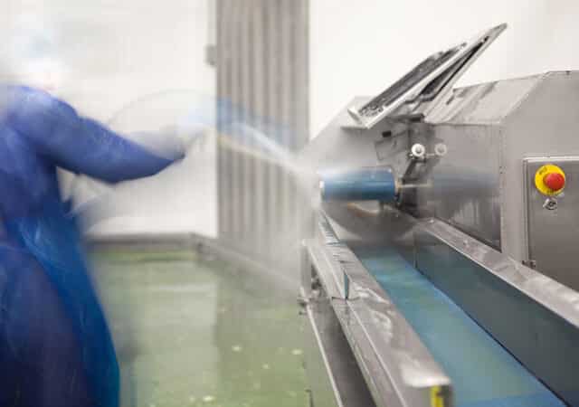 Cleaning a food processing machine